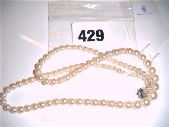 Single strand cultured pearl necklace with sapphire & diamond-set white metal clasp (unmarked)